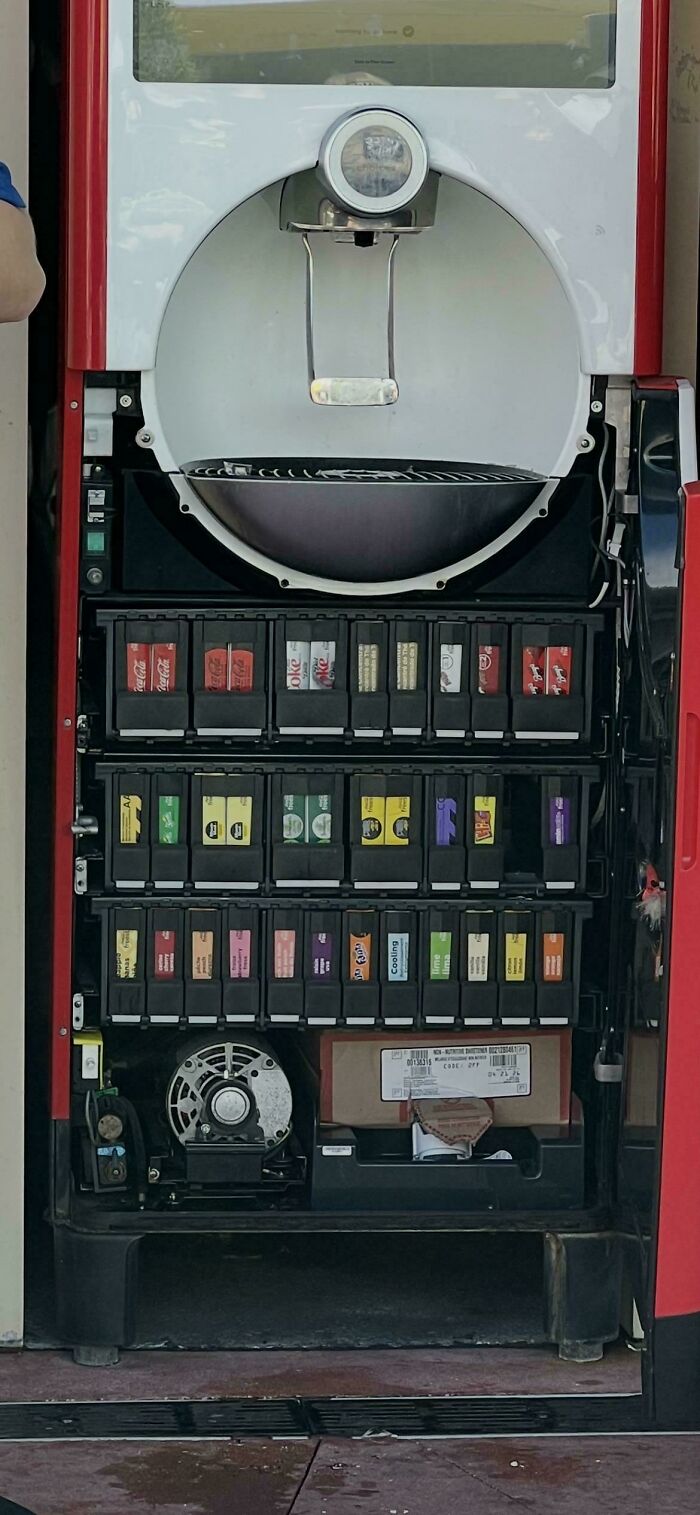 An open Coca-Cola Freestyle machine showing the internal flavor cartridges, an unexpected view that made the day interesting.