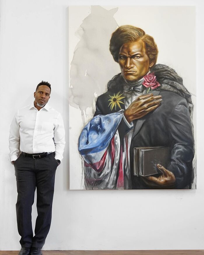 An artist standing proudly next to his incredible portrait, showcasing his artistic accomplishments.