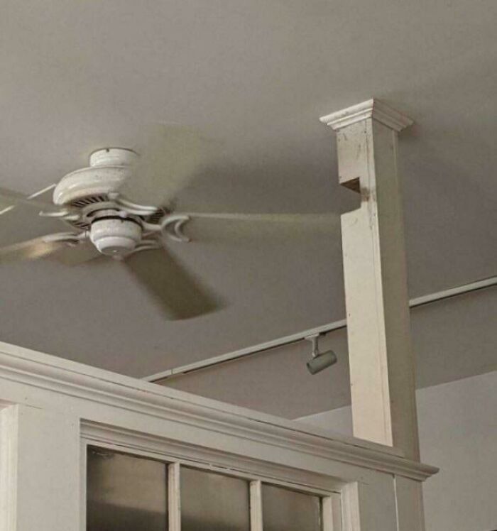 Hilariously bad DIY room design with a ceiling fan blade hitting a decorative column.