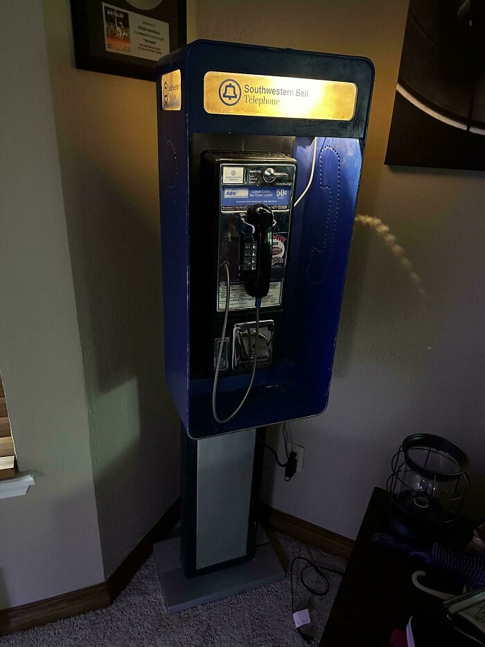 A vintage blue Southwestern Bell telephone booth, an unexpected moment that made the day more interesting.