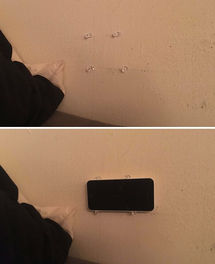 Two images showing a hilariously bad DIY phone holder with four thumbtacks holding a smartphone against a wall.