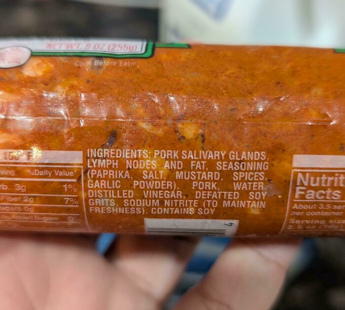 Close-up of food packaging revealing unusual ingredients like pork salivary glands, an unexpected and interesting moment.