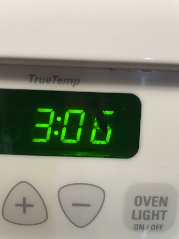 An oven display shows 3:00, with a broken segment, an infuriating obstacle to reading the time.