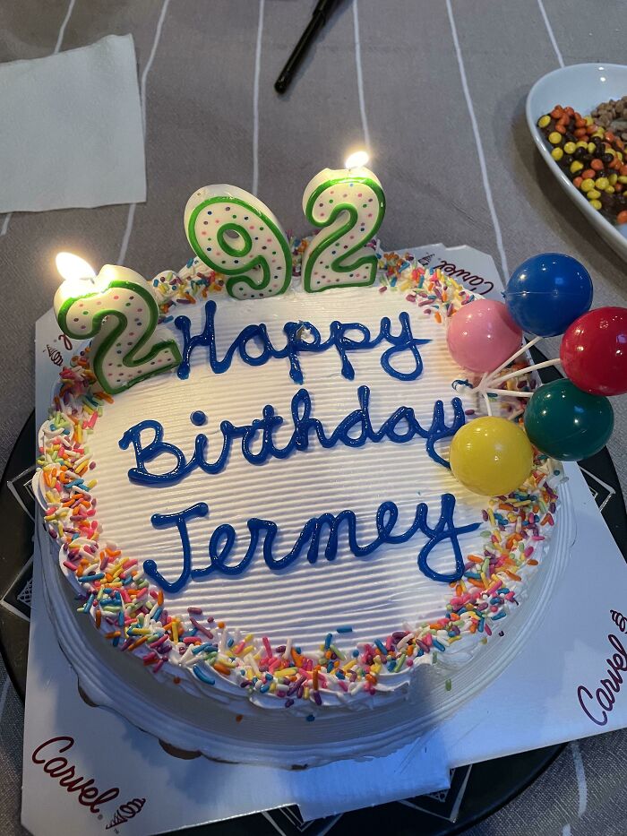 A birthday cake for Jeremy with candles that spell 92 and 22, a mildly infuriating age mix-up.