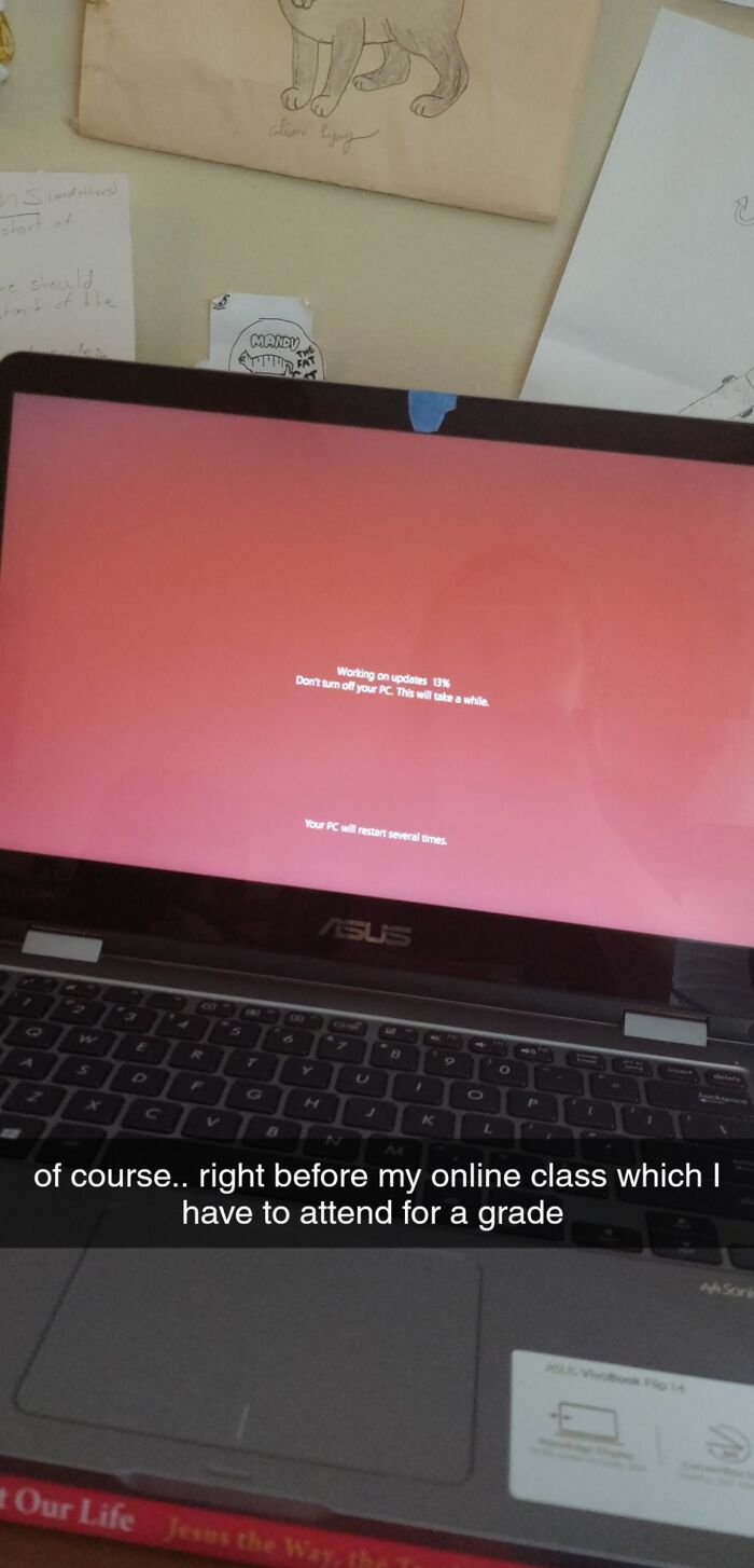 A laptop updating, causing a mildly infuriating obstacle right before an online class.
