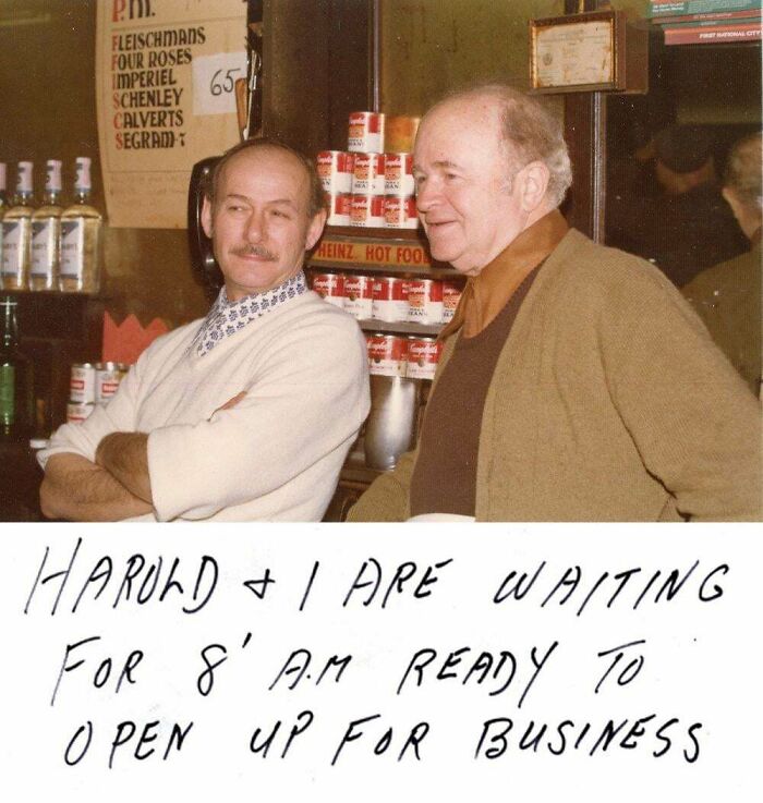 Rare American history photo captures two men behind a counter, possibly a store, with the handwritten note below stating they're ready to open.