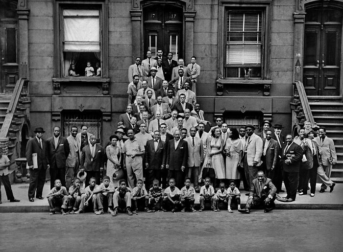 Rare American History photo of a large group of people posing on steps and street.