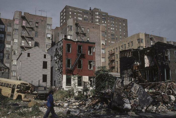 Fascinating American History photo of a desolate urban landscape with damaged buildings and debris.