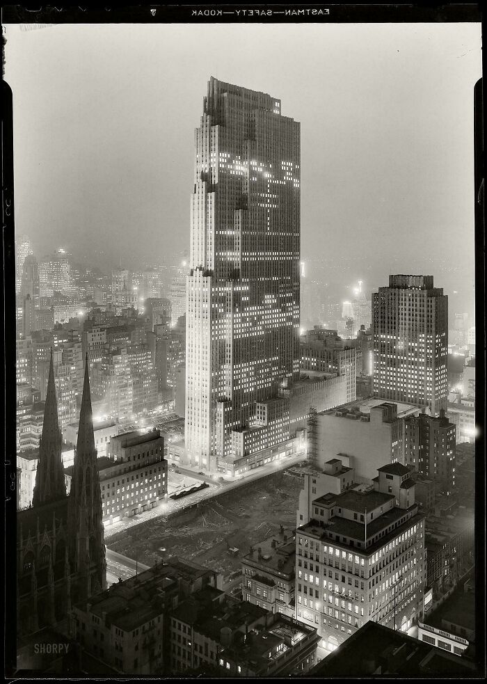 Rare photo of Rockefeller Center and surrounding skyscrapers at night from American history.