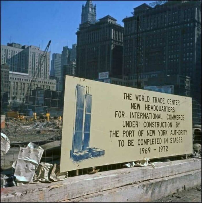 Rare photo of World Trade Center under construction sign, a fascinating moment in American history.