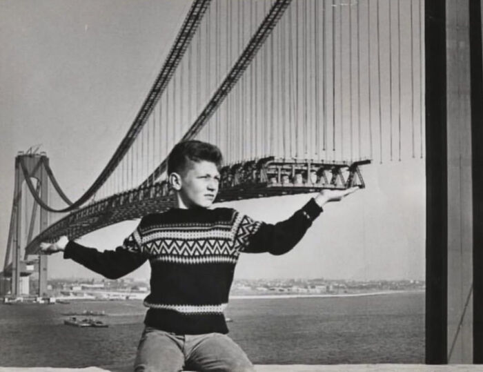 Rare American History photo: A young boy poses with a bridge in a fascinating optical illusion.