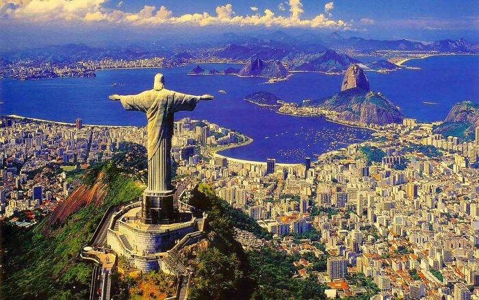 An iconic and fascinating photo from American history, featuring the Christ the Redeemer statue overlooking Rio de Janeiro, Brazil.