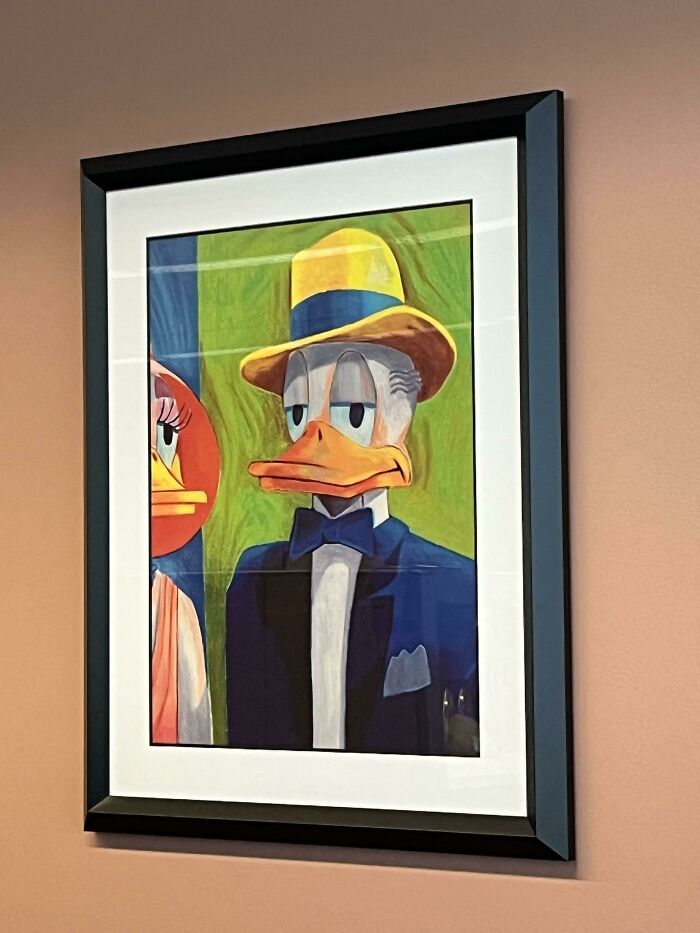 A framed painting of Donald Duck in a suit and hat, an item people lost hope to find.