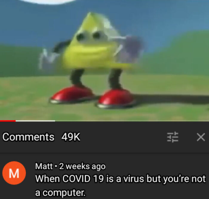 A blursed comment under a video featuring a dancing yellow triangle, humorously stating, When COVID 19 is a virus but you're not a computer.