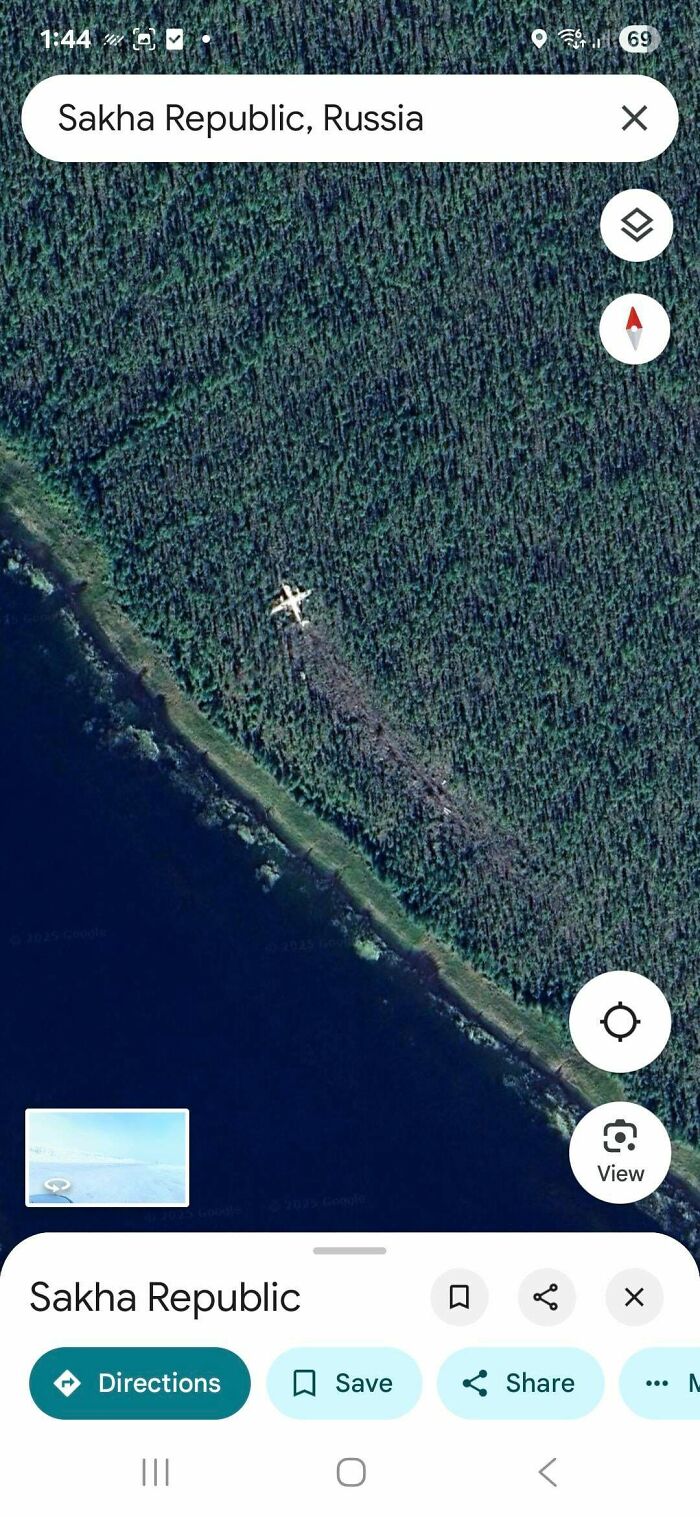 A Google Maps screenshot showing an airplane on the ground next to a body of water in the Sakha Republic. People find odd things.