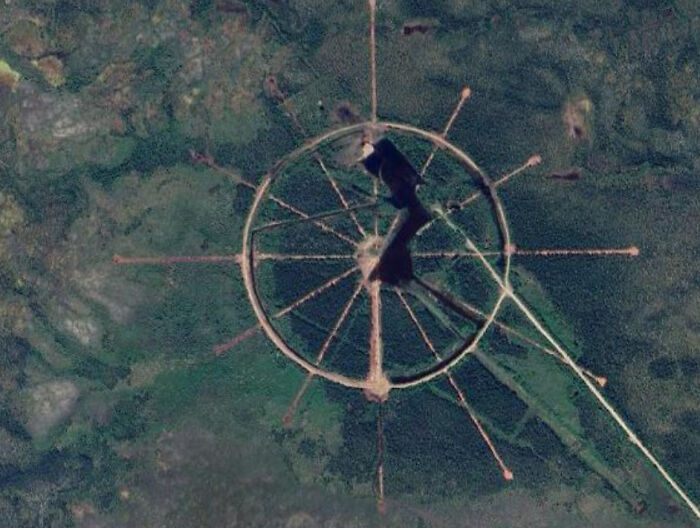 Odd things on Google Maps: A circular design with spokes, resembling a wheel, in a green area.