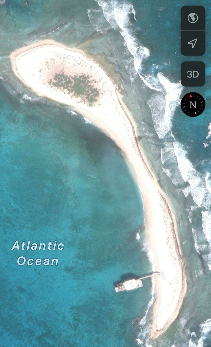Odd things found on Google Maps: an aerial view of an island in the Atlantic Ocean shaped like a spoon.