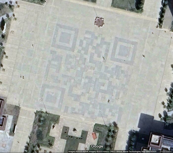 Odd things found on Google Maps: a massive QR code pattern covering a large paved area.
