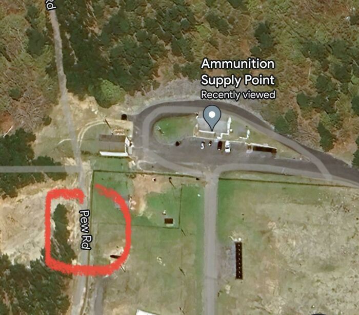 An aerial Google Maps image of an Ammunition Supply Point, with Pew Rd highlighted, revealing odd road names.
