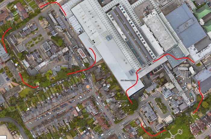 An overhead Google Maps view of a suburban area with red lines highlighting pathways, revealing odd things found on Google Maps.