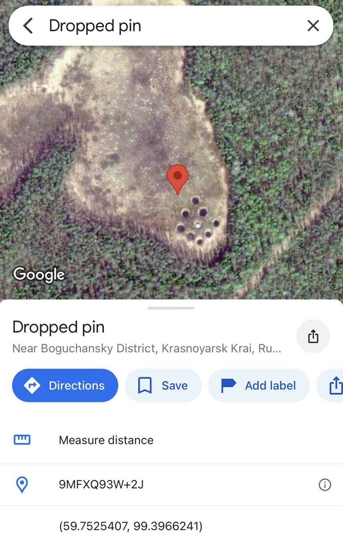 A Google Maps satellite view showing a dropped pin on a circular formation of holes in a clearing, highlighting odd things found.