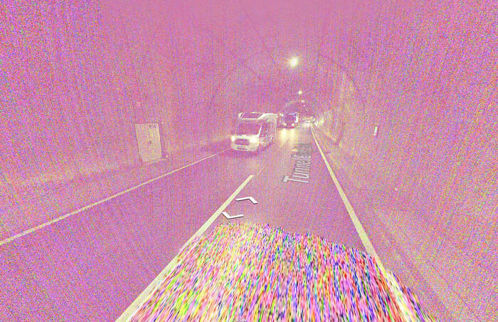 Odd things on Google Maps: a glitchy, psychedelic tunnel view with a pixelated road and cars.