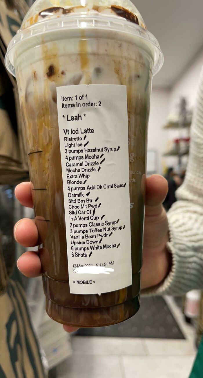 A close-up of a Starbucks drink with a very long list of customizations, highlighting little hope for humanity.