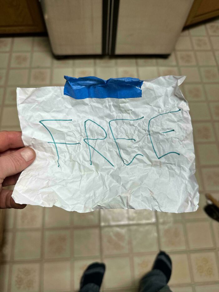 A crumpled piece of paper with the word FREE written on it, representing ironic hope for humanity.