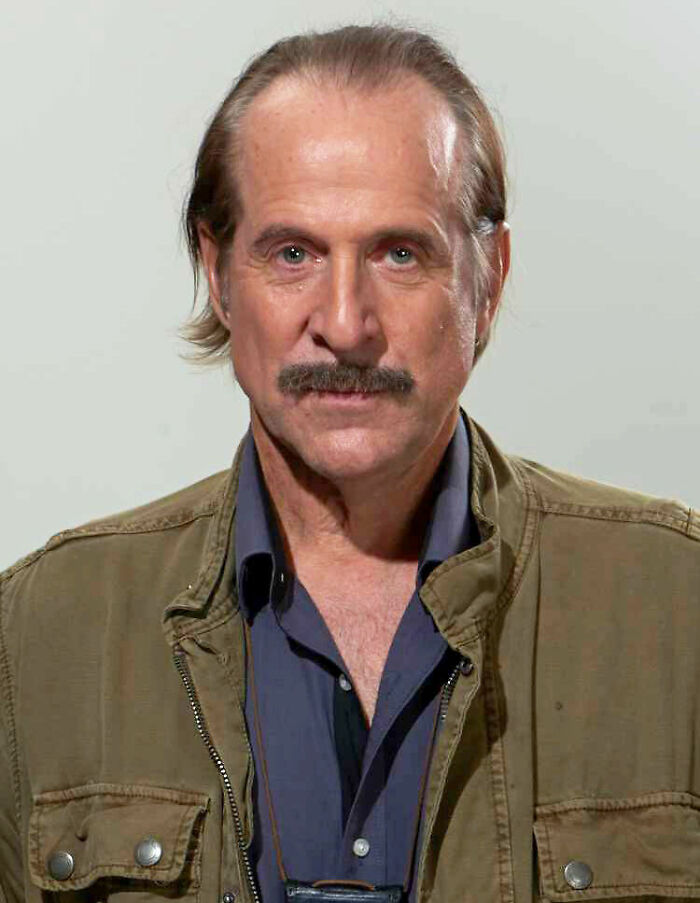 Peter Stormare, an actor known for his diverse career, gazes directly at the camera, portraying his distinctive look.