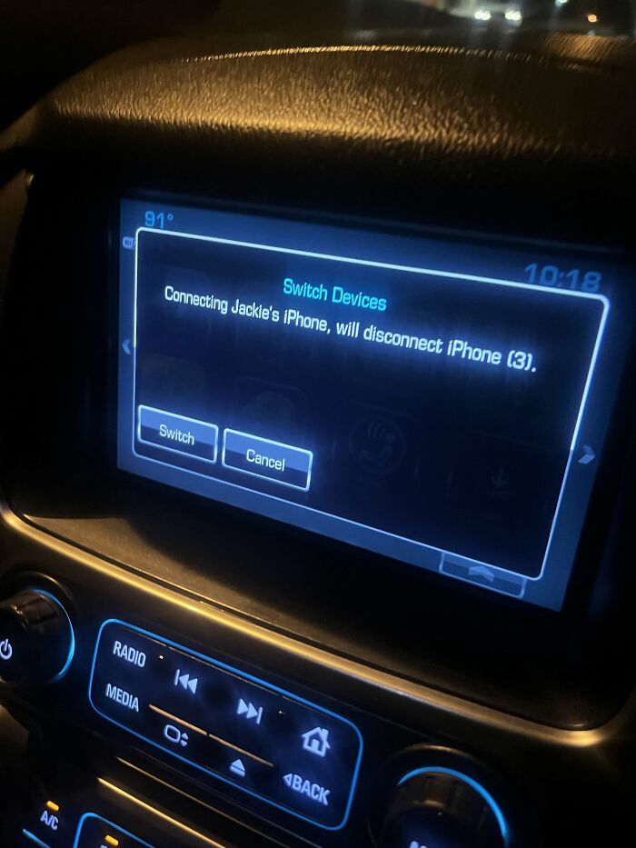 A car infotainment system displaying a prompt to switch devices, a sign from the universe.