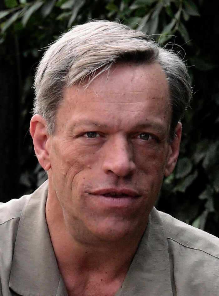 Brian Thompson, an actor known for his career highlights, looks directly at the camera in a close-up.