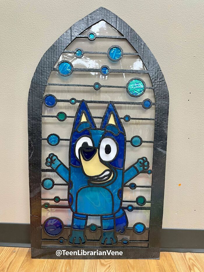 Bluey character in a stained glass window design, showcasing amazing crafts and creativity.