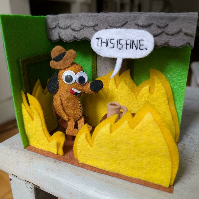 Felt diorama of a dog in a burning room saying This is fine, demonstrating amazing crafts.