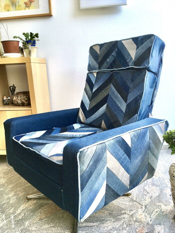 An amazing craft of a recliner chair upholstered with a patchwork of blue denim fabrics.