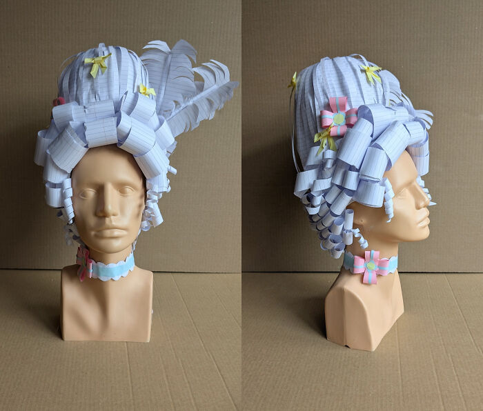 Amazing crafts: Intricate paper wig on a mannequin, showcasing creativity and going above and beyond.