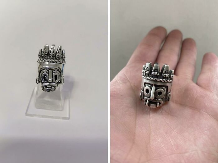 A split image shows an intricate silver ring, shaped like a stylized face, on a stand and then held in a person's palm, an amazing craft.