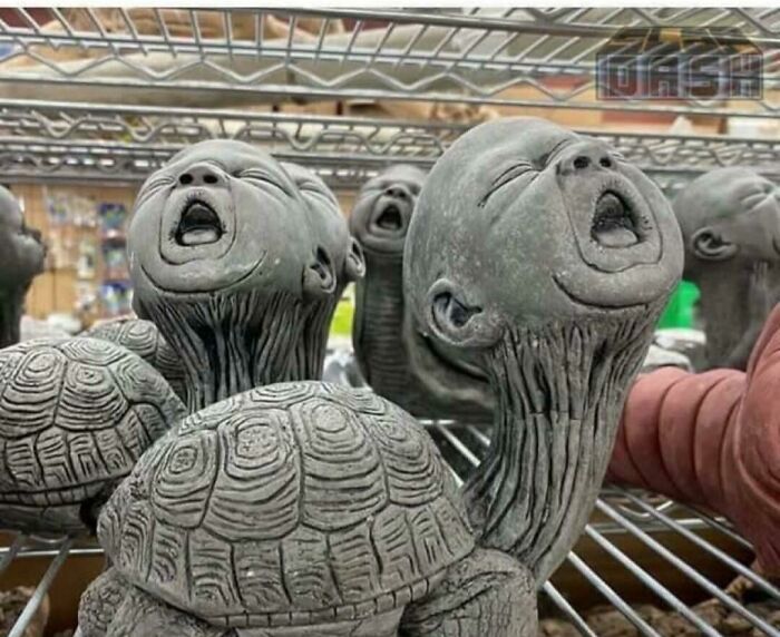 Creepy turtle statues with human baby heads screaming, representing awful ideas executed with disturbing skill.