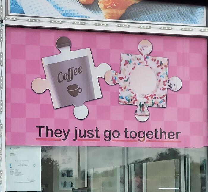 A sign with two puzzle pieces, one with coffee and the other a doughnut, illustrating people so dumb.