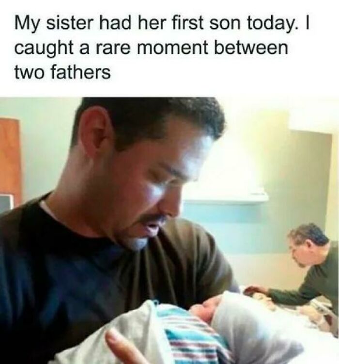 Two fathers admiring a newborn baby in a hospital, a wholesome moment of joy and family.
