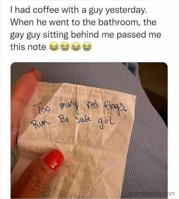 A person holding a handwritten note with red flags, a wholesome post about a funny and supportive warning from a stranger.