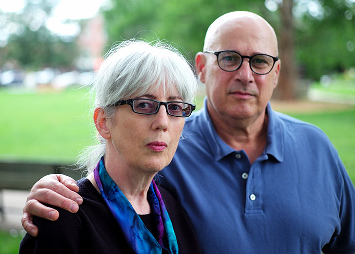 An old couple, victims of an eBay campaign, looks directly at the camera. eBay karma backfires spectacularly.