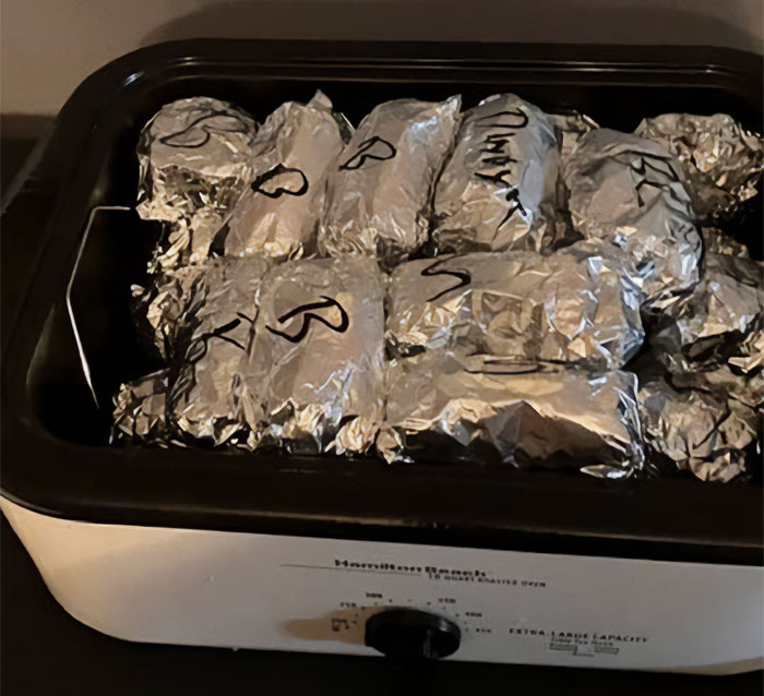 A Hamilton Beach roaster oven filled with individual breakfast servings wrapped in foil, prepared by a Missouri Grandma. A Hamilton Beach roaster oven filled with individual breakfast servings wrapped in foil, prepared by a Missouri Grandma.