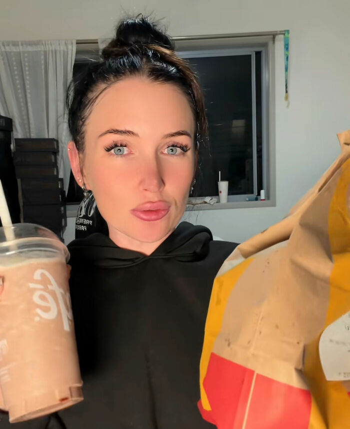 A devastated mom after a humiliating moment, holding fast food, maybe trying to make new friends. A devastated mom after a humiliating moment, holding fast food, maybe trying to make new friends.
