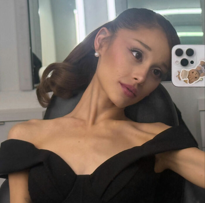 Ariana Grande in a black off-the-shoulder dress, posing for a photo. She recently dropped out of an acting role. Ariana Grande in a black off-the-shoulder dress, posing for a photo. She recently dropped out of an acting role.