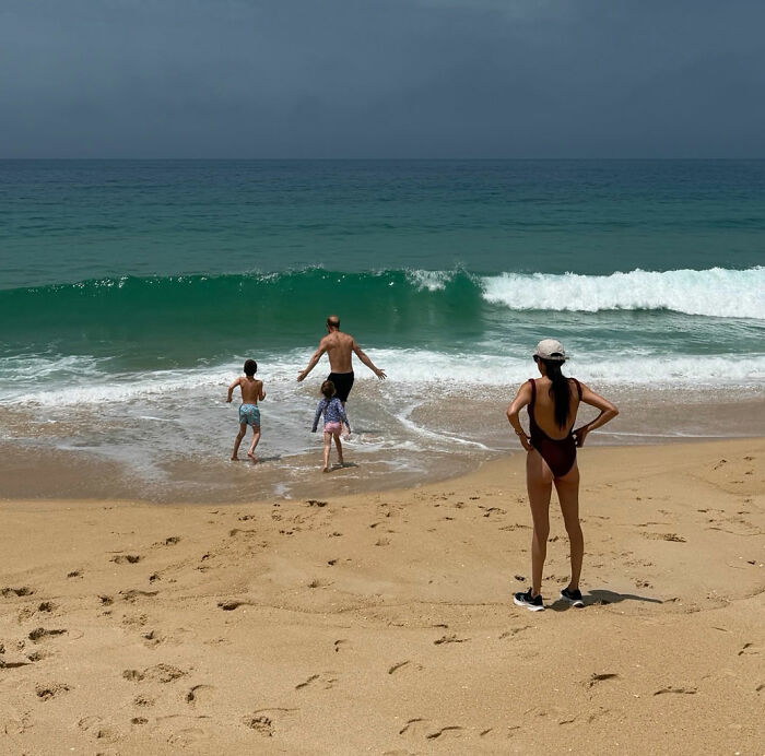 Meghan Markle watching Prince Harry and two children run into the ocean, amid theories about their move to the UK. Meghan Markle watching Prince Harry and two children run into the ocean, amid theories about their move to the UK.
