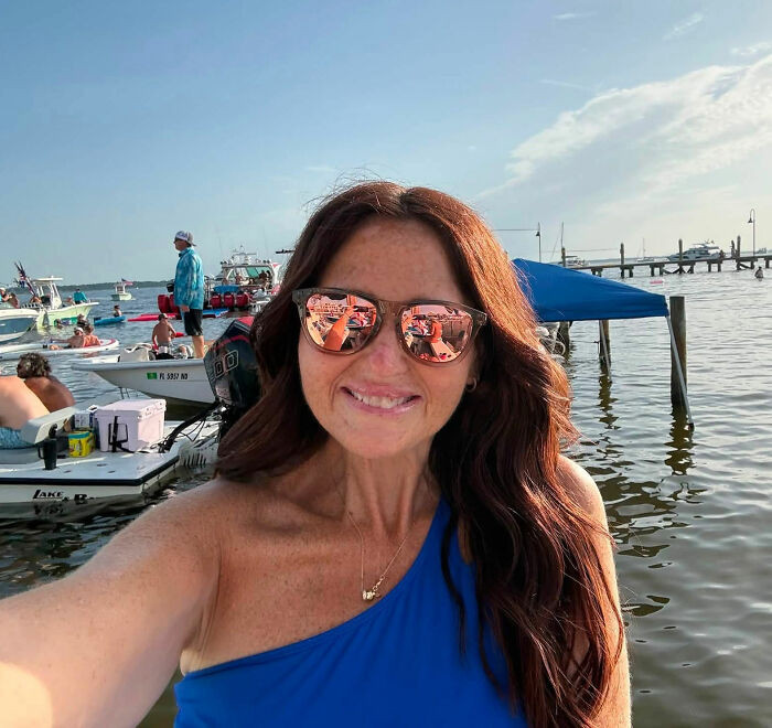 A woman in sunglasses on a boat, warning women about common pre-swim habits and flesh-eating bacteria. A woman in sunglasses on a boat, warning women about common pre-swim habits and flesh-eating bacteria.