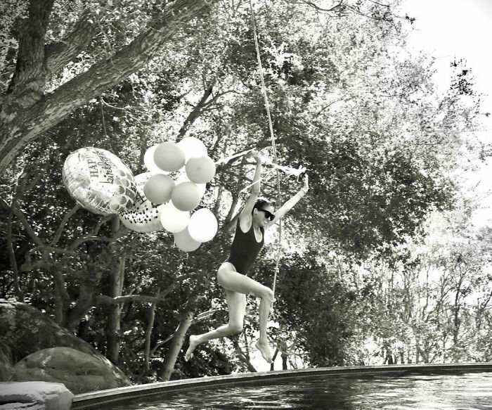 Meghan Markle jumps into a pool holding birthday balloons. Fans point out details. Meghan Markle jumps into a pool holding birthday balloons. Fans point out details.
