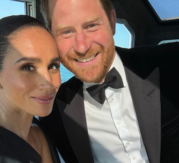 Meghan Markle and Prince Harry smiling in formal wear, possibly related to their move back to UK. Meghan Markle and Prince Harry smiling in formal wear, possibly related to their move back to UK.