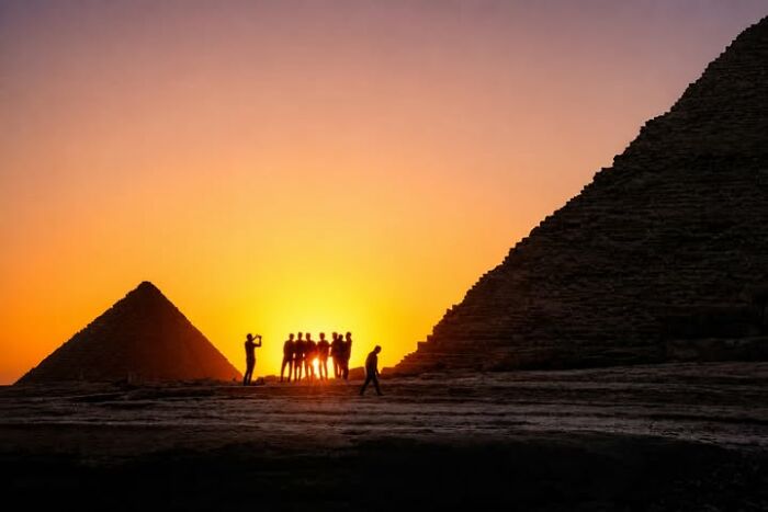 Murat Bakmaz captures the easily missed beauty of everyday life, showcasing silhouettes of people at pyramids at sunset.