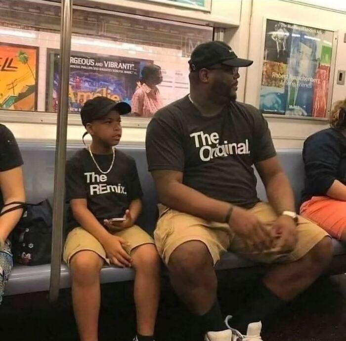 A photographer captures a funny moment of a father and son on a subway, wearing matching The Original and The Remix shirts.